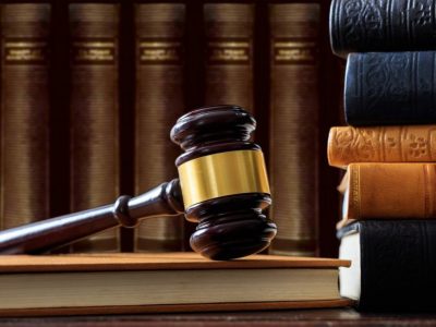 judge-gavel-on-a-book-law-books-background-wooden-desk-e1622361337922.jpg